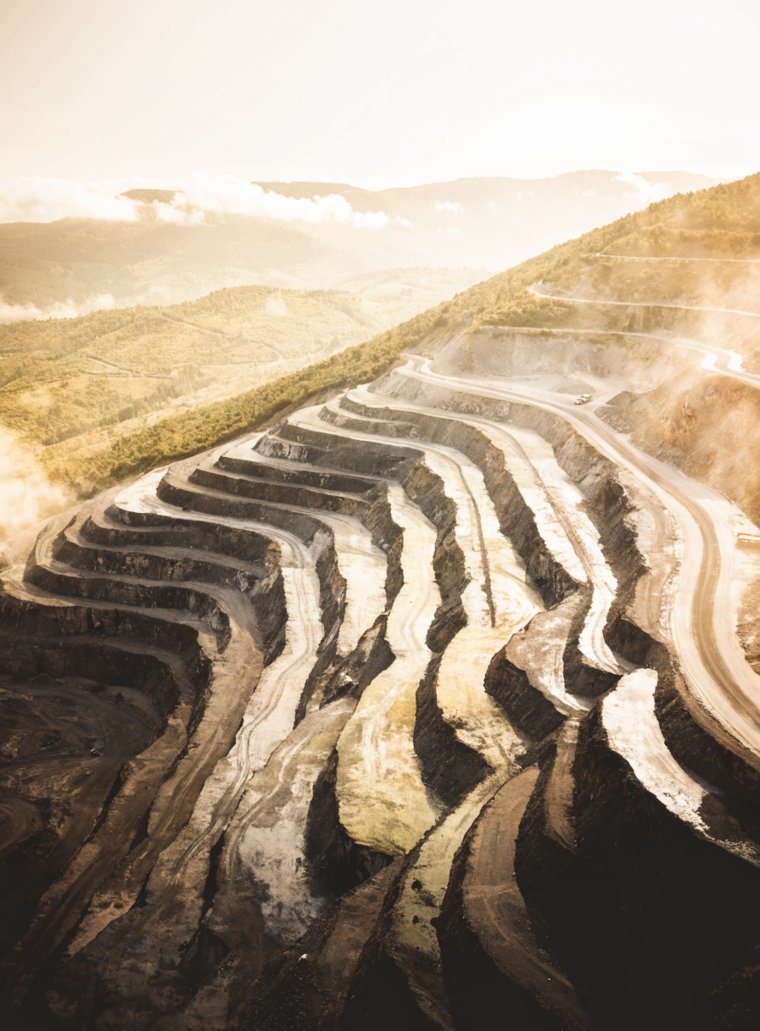Mining, an aerial view of the Group's terraced open-pit operations at first light